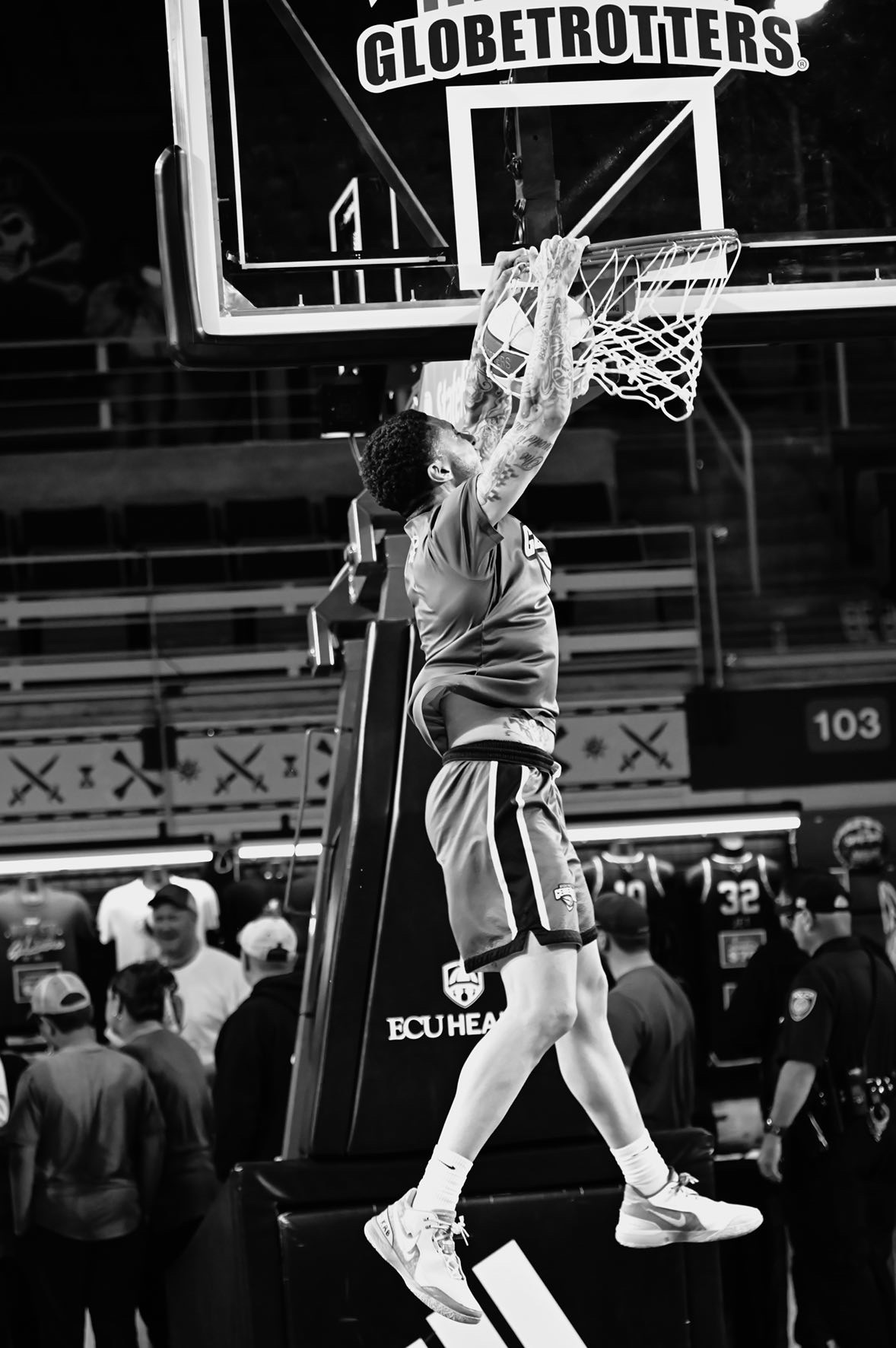 Coach Sam Baker finishing at the rim during a Harlem Globetrotters event